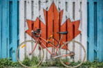 Fence with Canadian flag, with bike in front
